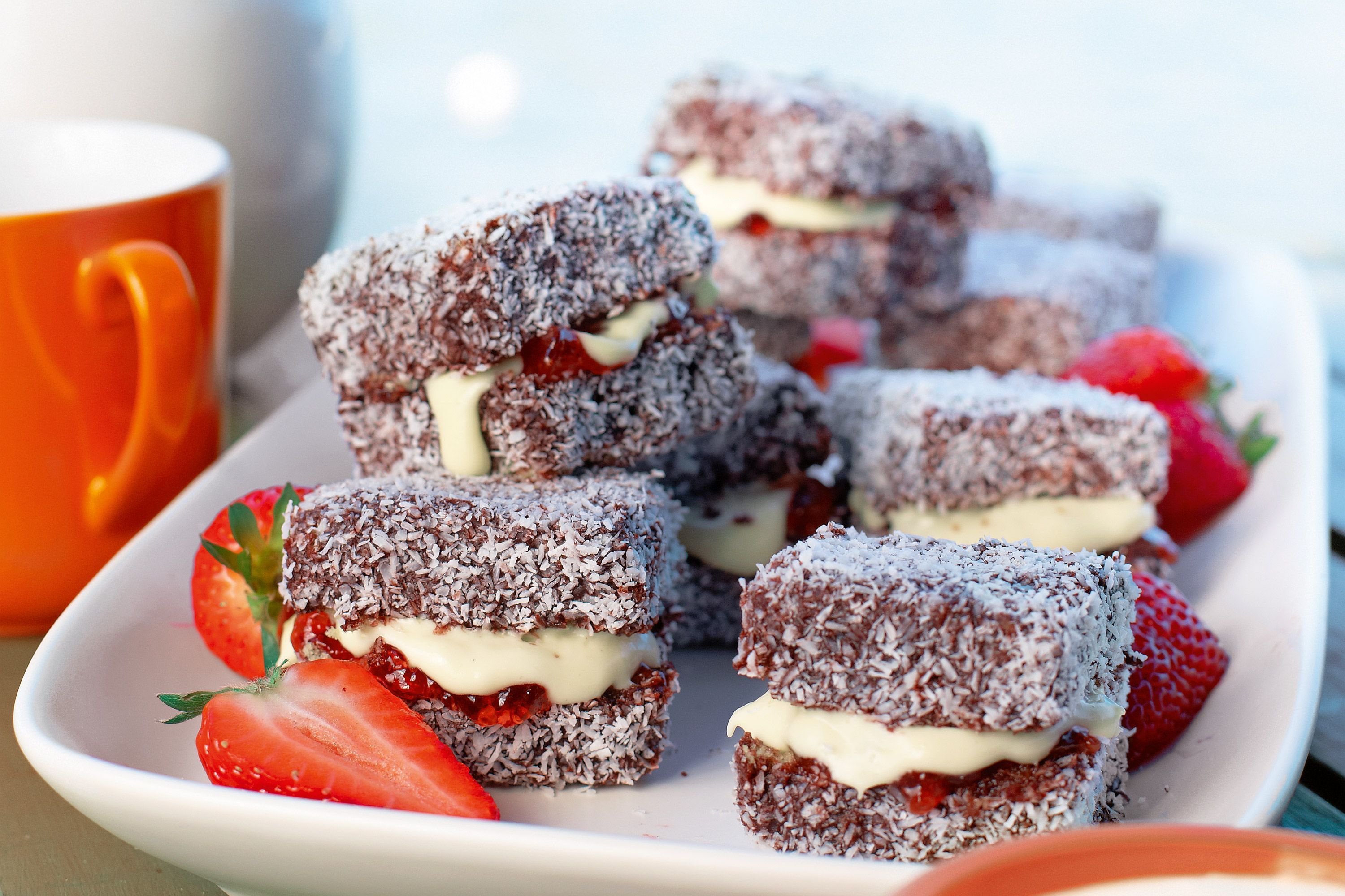 Delicious lamingtons topped with white chocolate cream