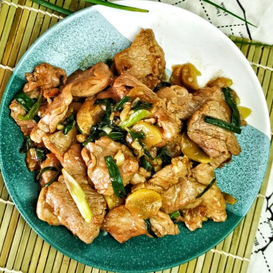 Pork stir-fry with ginger and spring onions