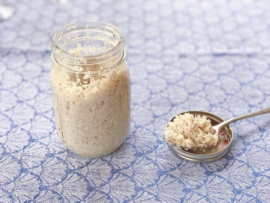 Fresh grated horseradish on a wooden board