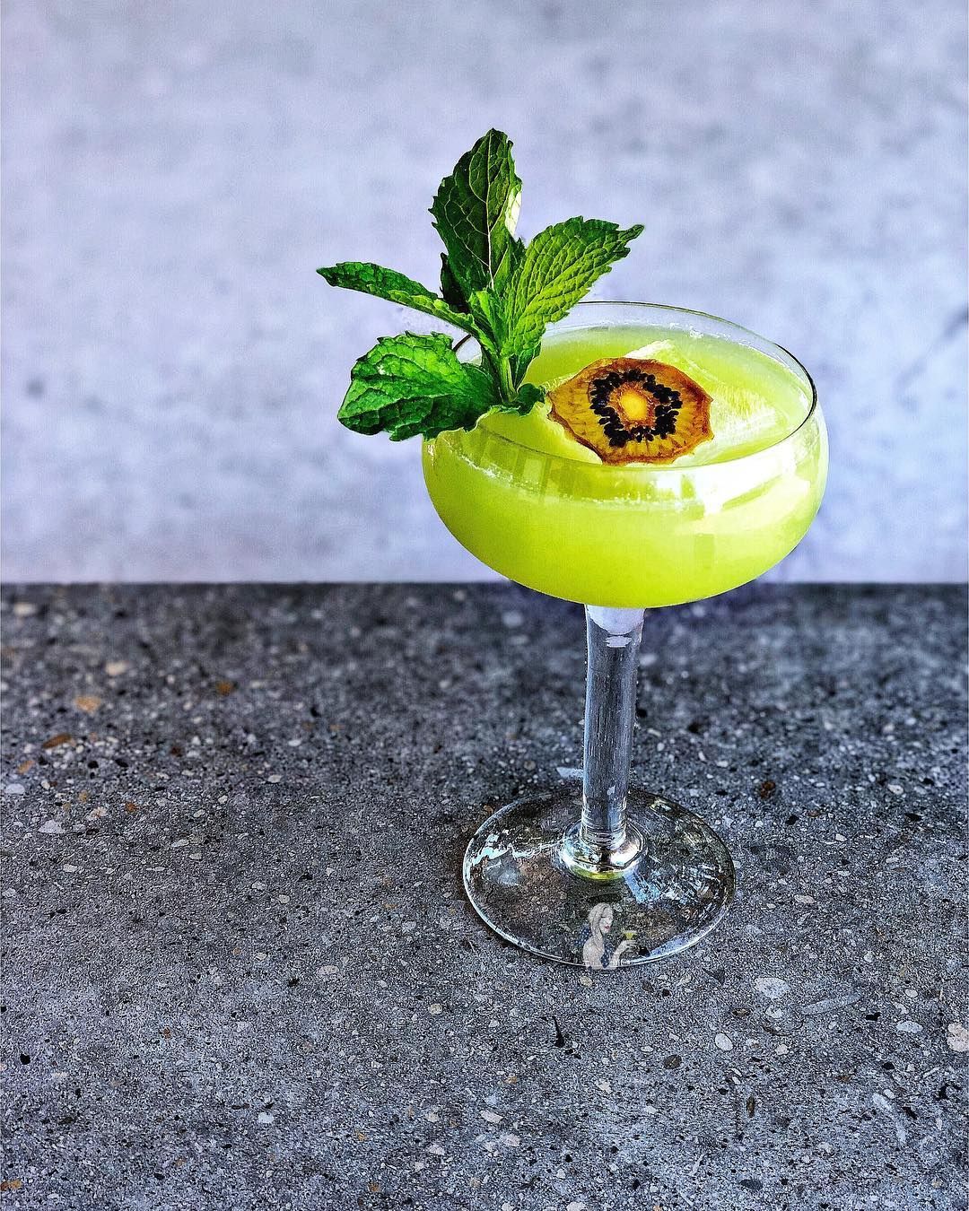 A refreshing Kiwi Margarita served in a glass