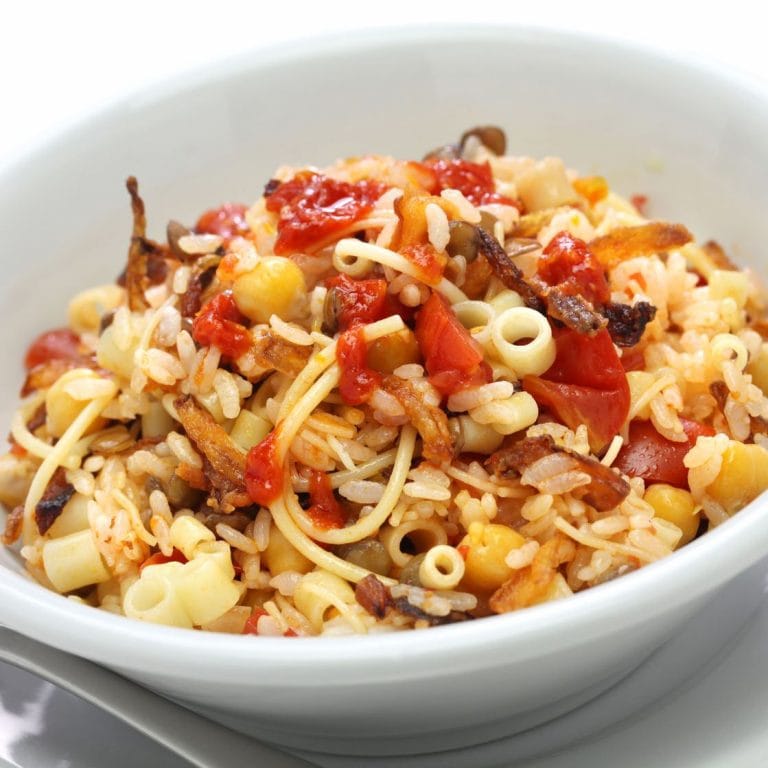 Egyptian Koshary - A colorful dish of rice, lentils, pasta, and fried onions