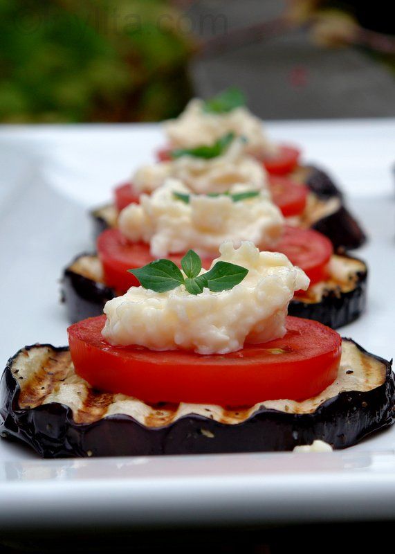 Grilled eggplant appetizer with tomato and garlic sauce