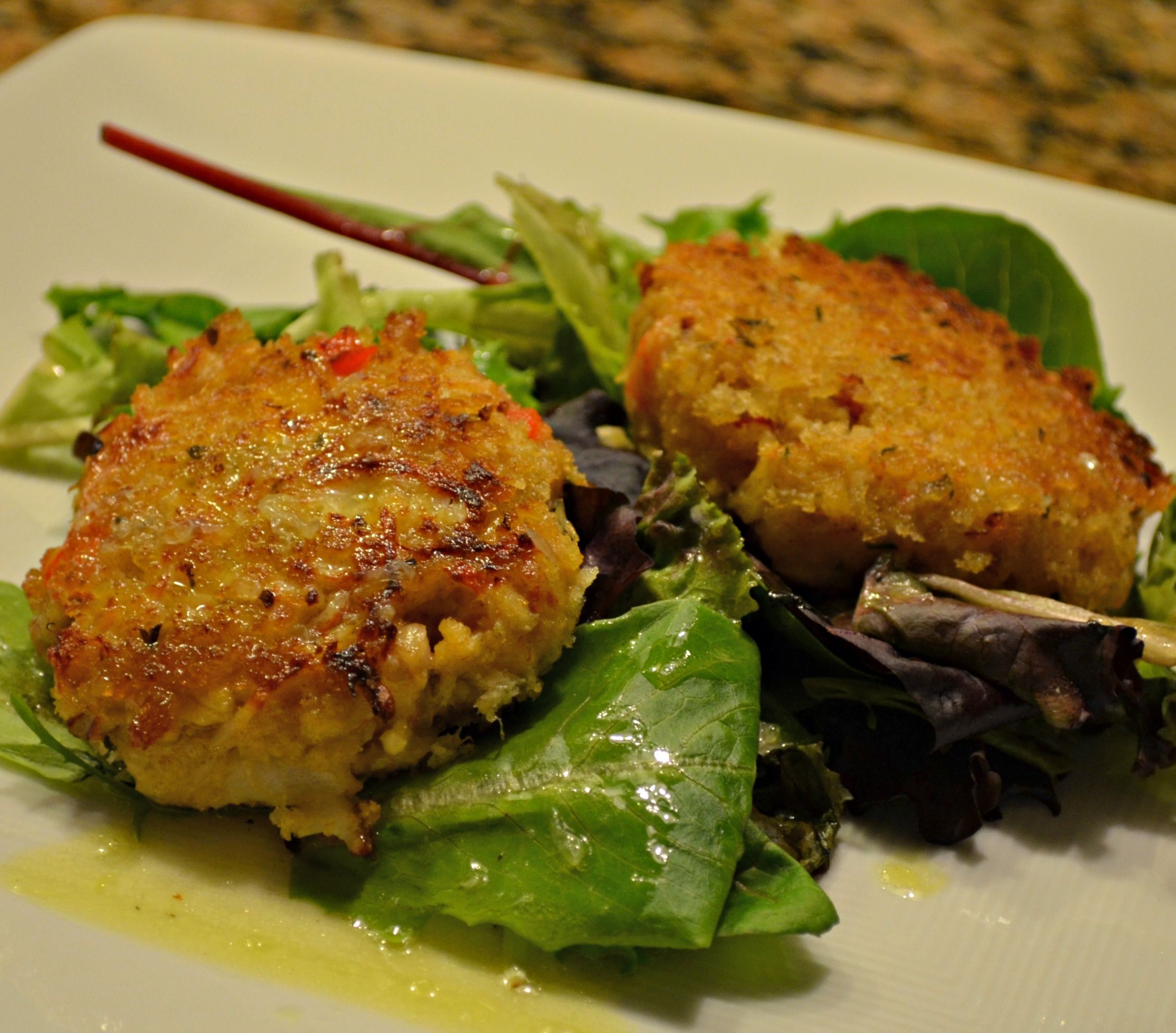 Deviled Crab Cakes on Mixed Greens with Ginger Citrus Vinaigrette
