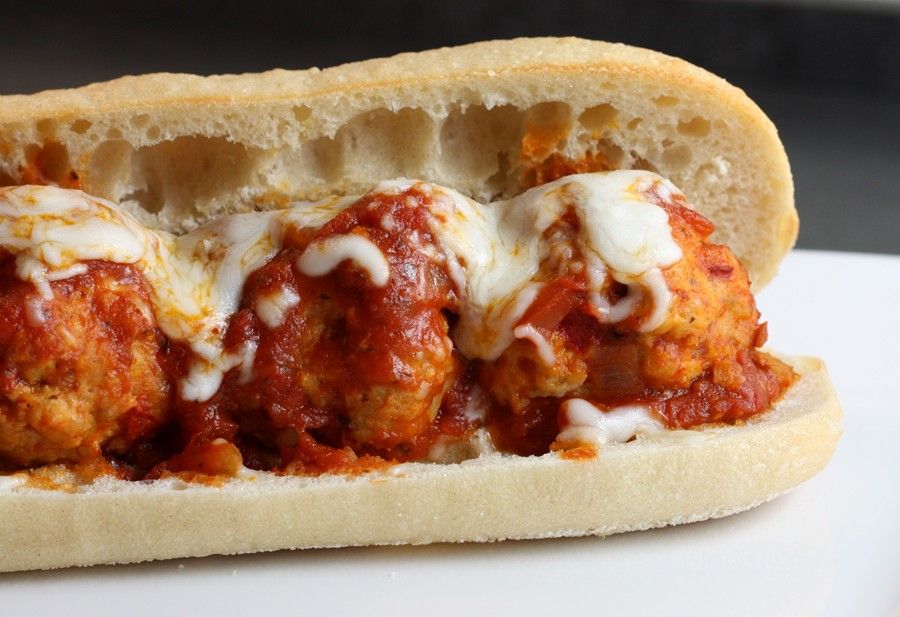 Delicious meatball grinder loaded with cheese and sauce