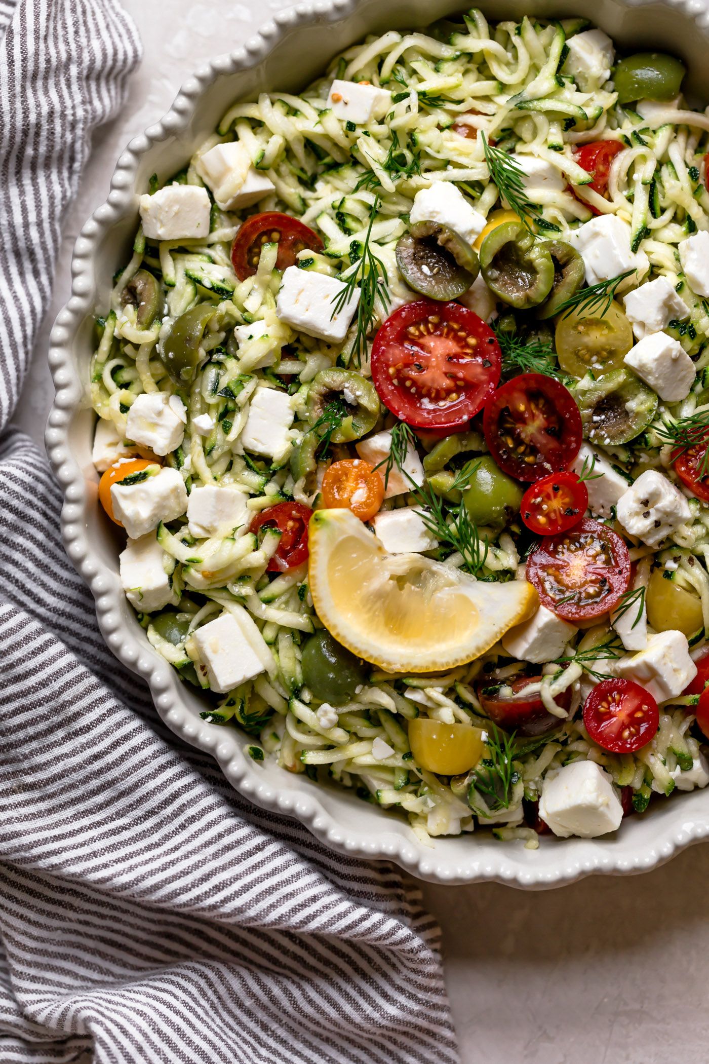 Lemony Grated Zucchini Salad with Tomatoes, Olives & Feta