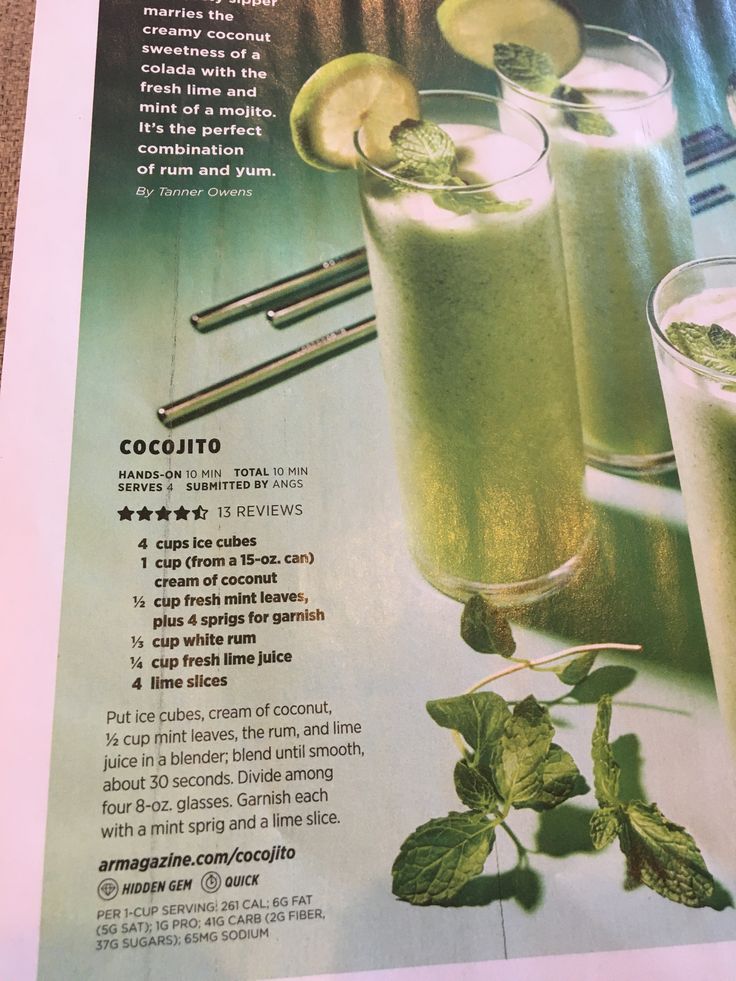 Cocojito drink in a tall glass with mint and lime garnishing