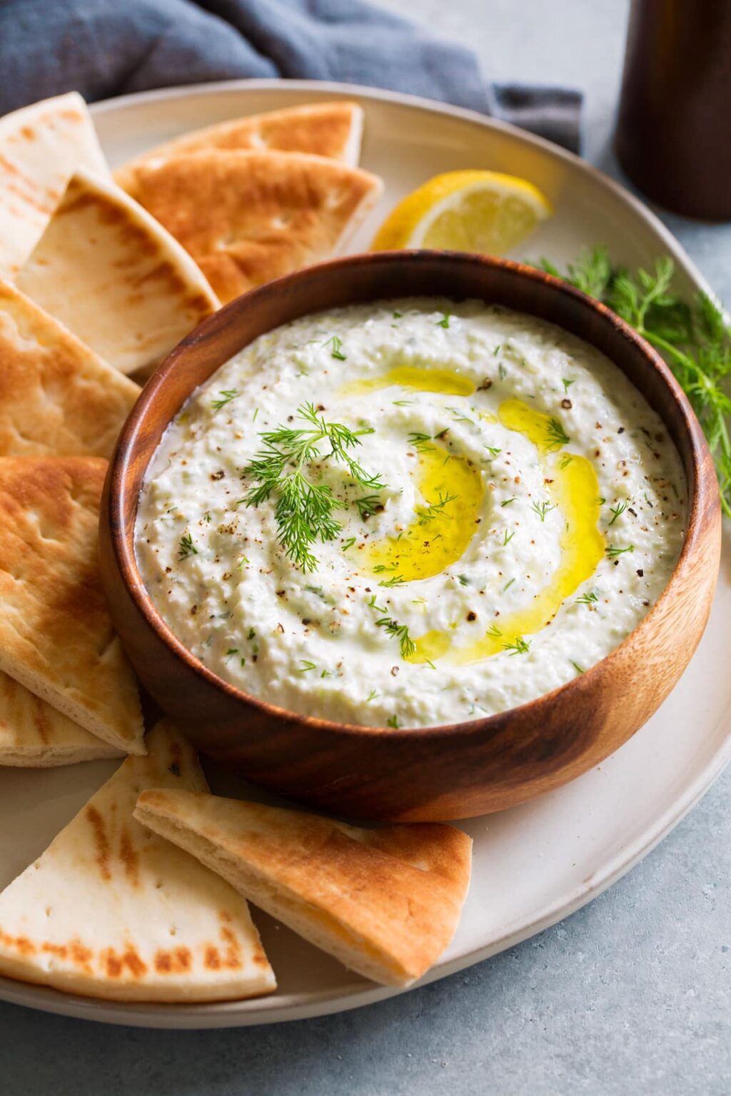 Salsa Tzatziki in a bowl garnished with herbs