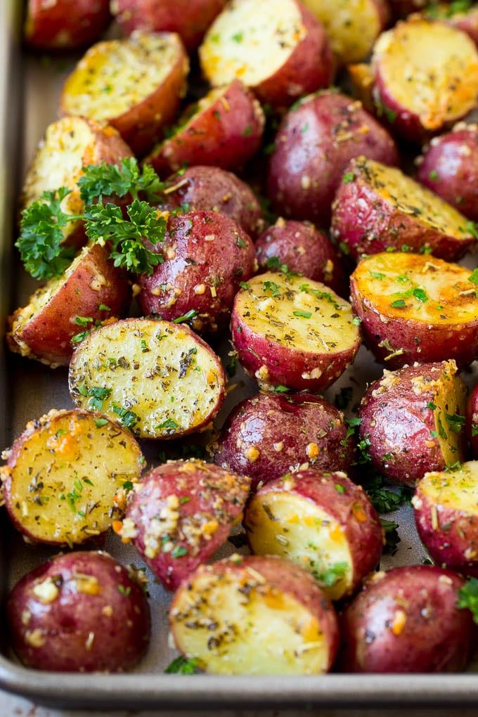 Delicious roasted red potatoes coated in garlic, herbs, and parmesan