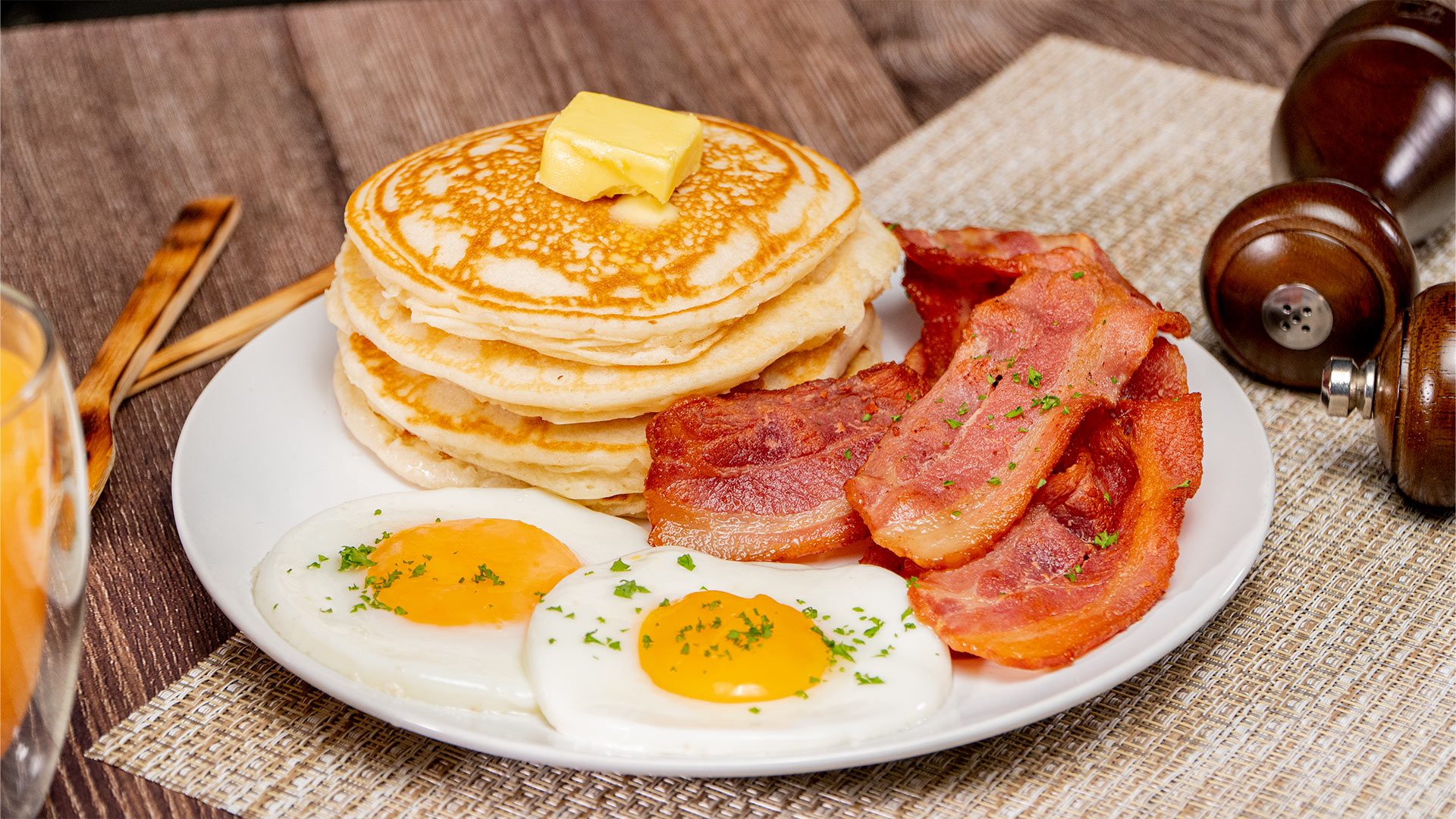 Sunny-Side-Up Eggs with Bacon and Pancakes