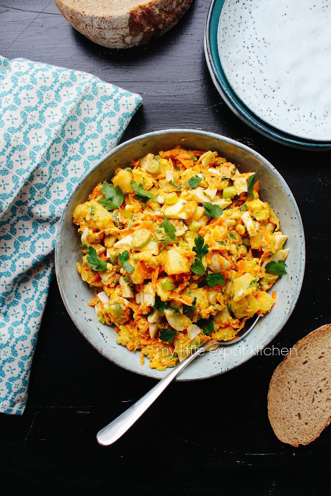 Potato and egg salad with carrots and spices