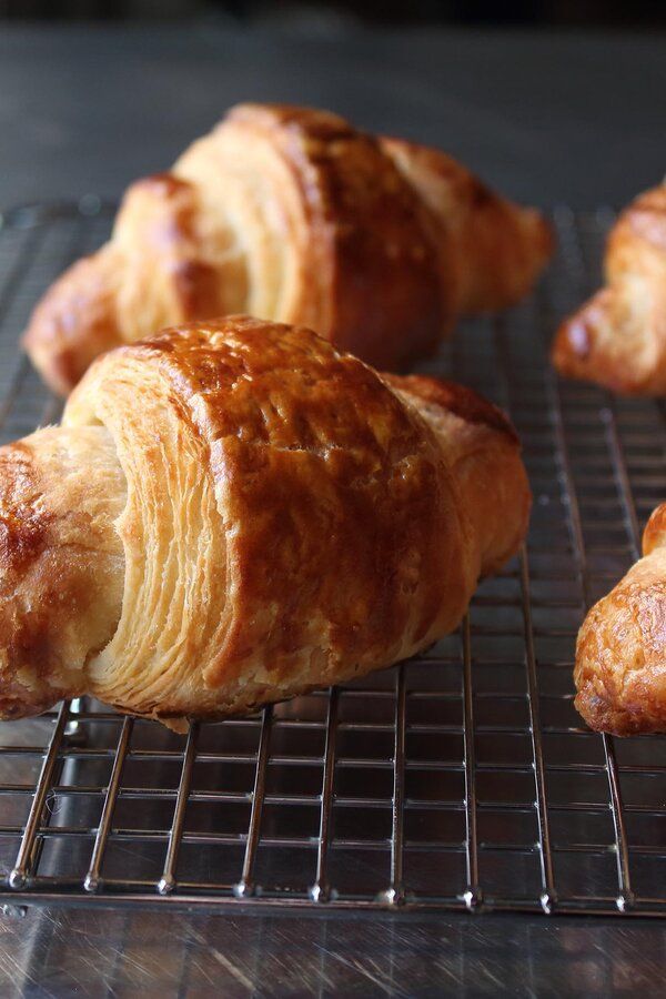 Freshly baked croissants on a wooden table